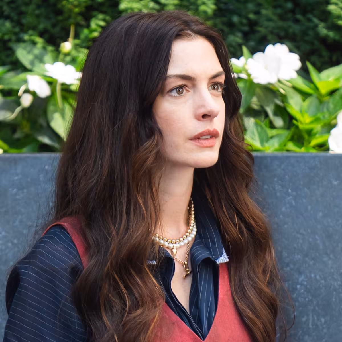 Stanley Tucci gets swept into Anne Hathaway’s sweater joke on Colbert