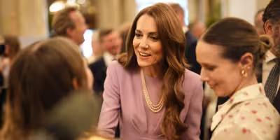 Kate Middleton says large royal settings are hard at Buckingham Palace reception