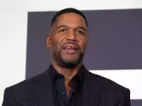 Michael Strahan marks 10 years of his brand with a red-suit post